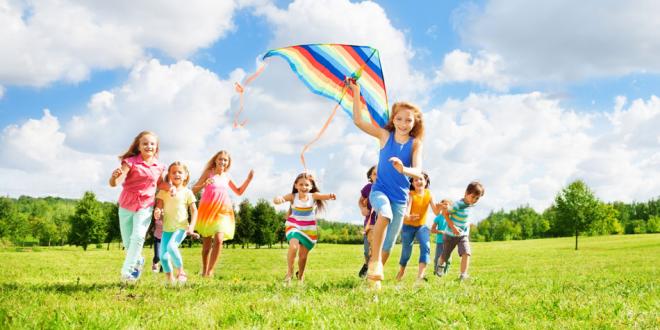 children running with kite